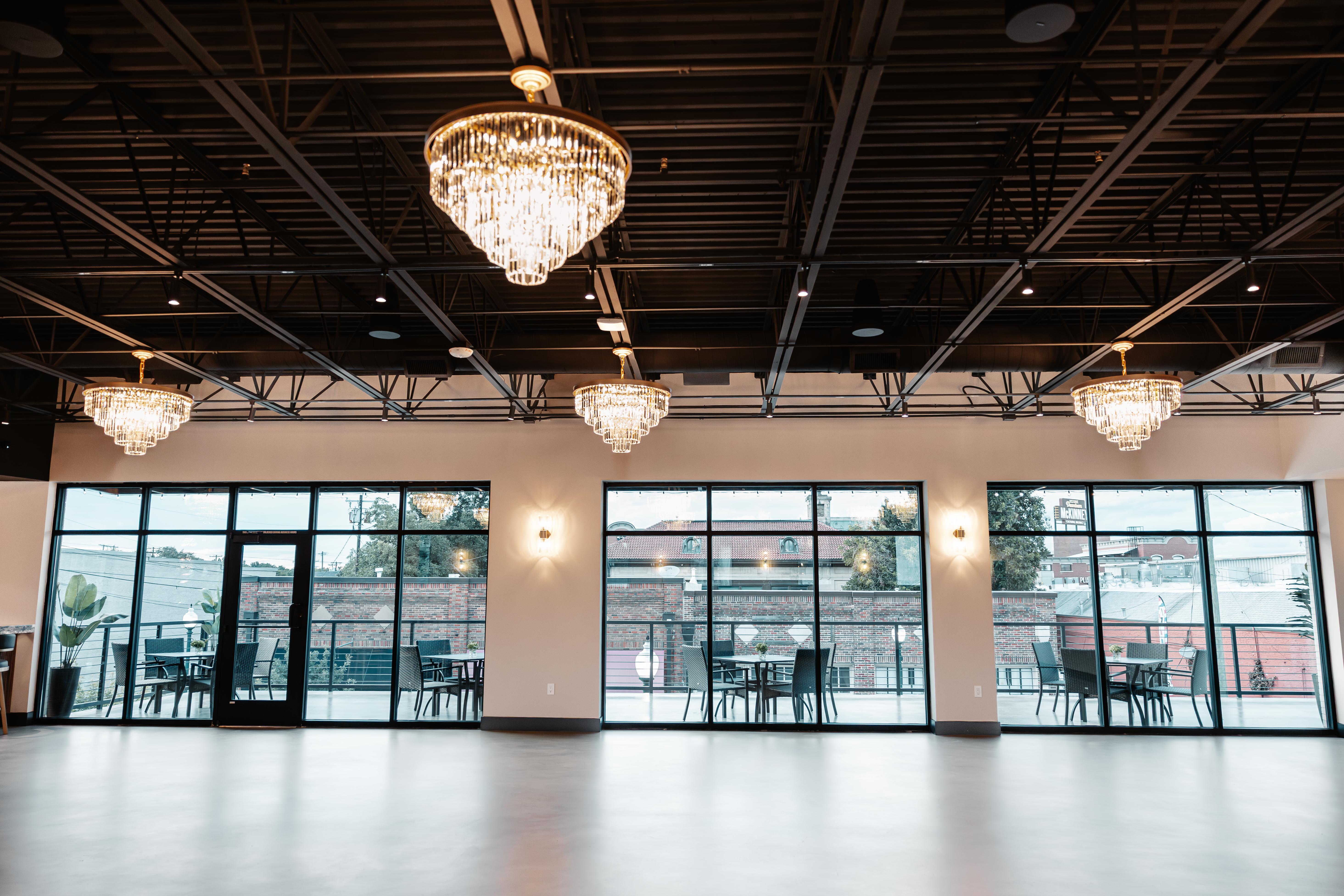 The Chestnut Hall wedding reception space with crystal chandeliers in downtown McKinney