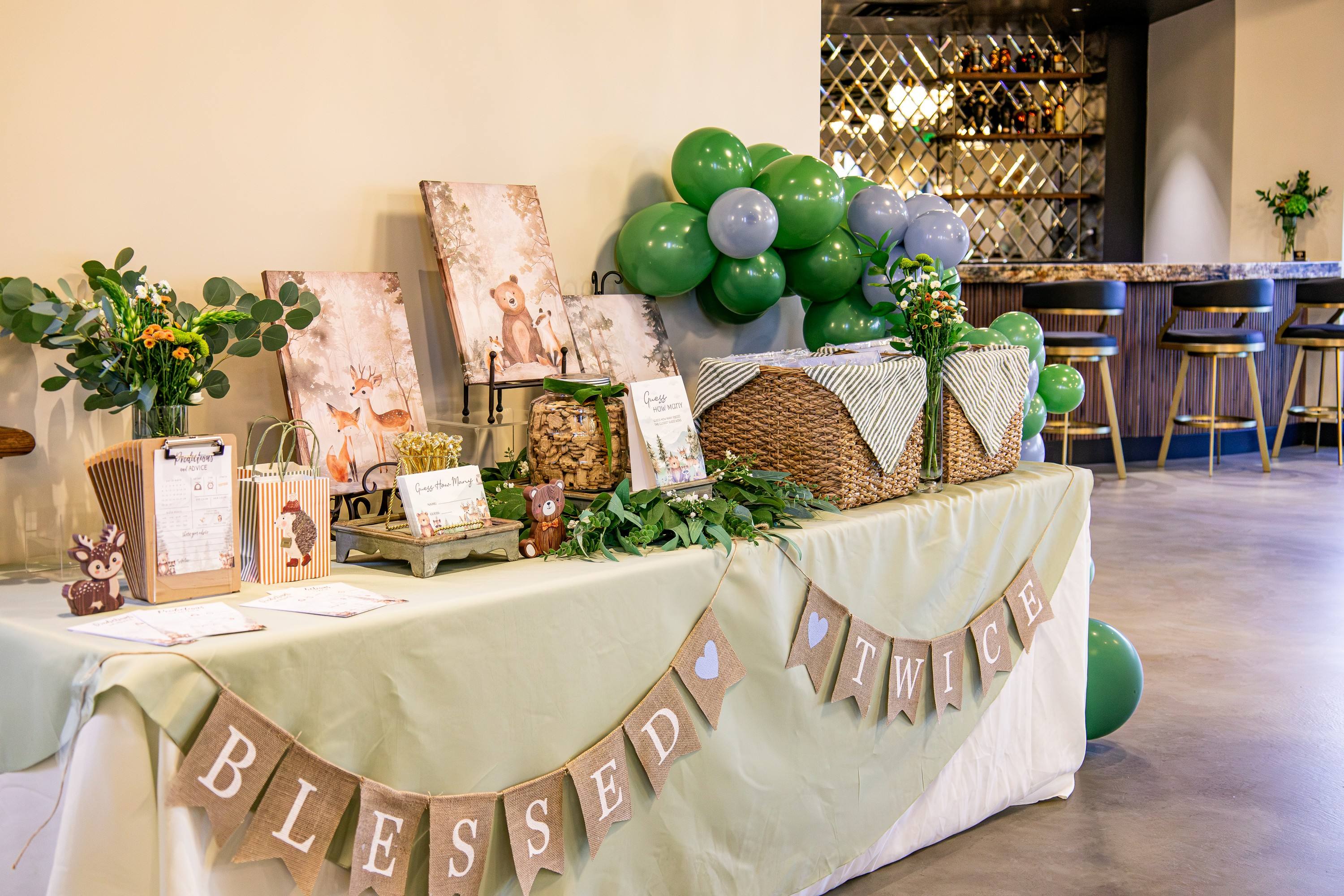 Baby shower gift table with the built-in bar behind it