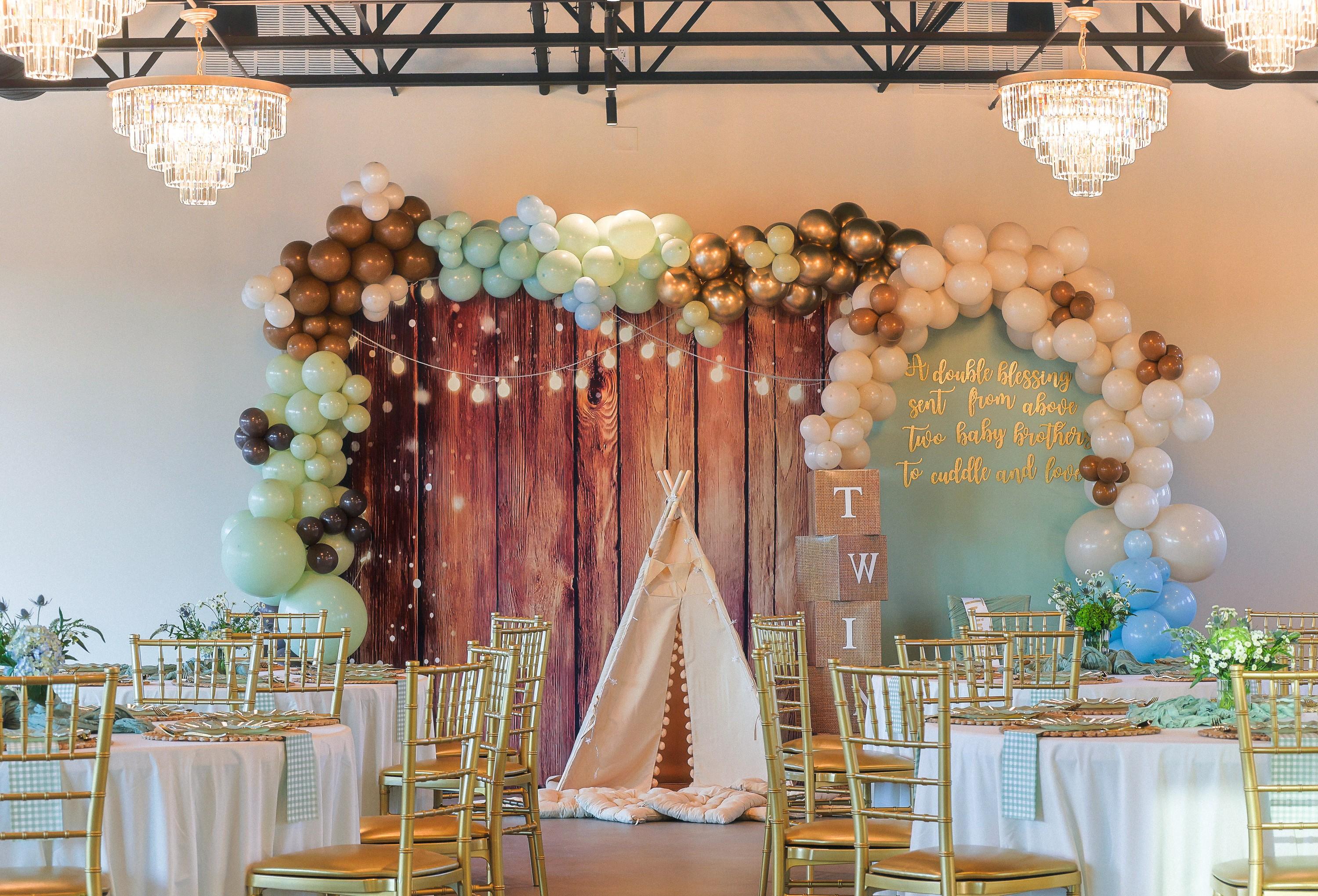 Baby shower balloon arch and woodland backdrop in the main hall at The Chestnut Hall