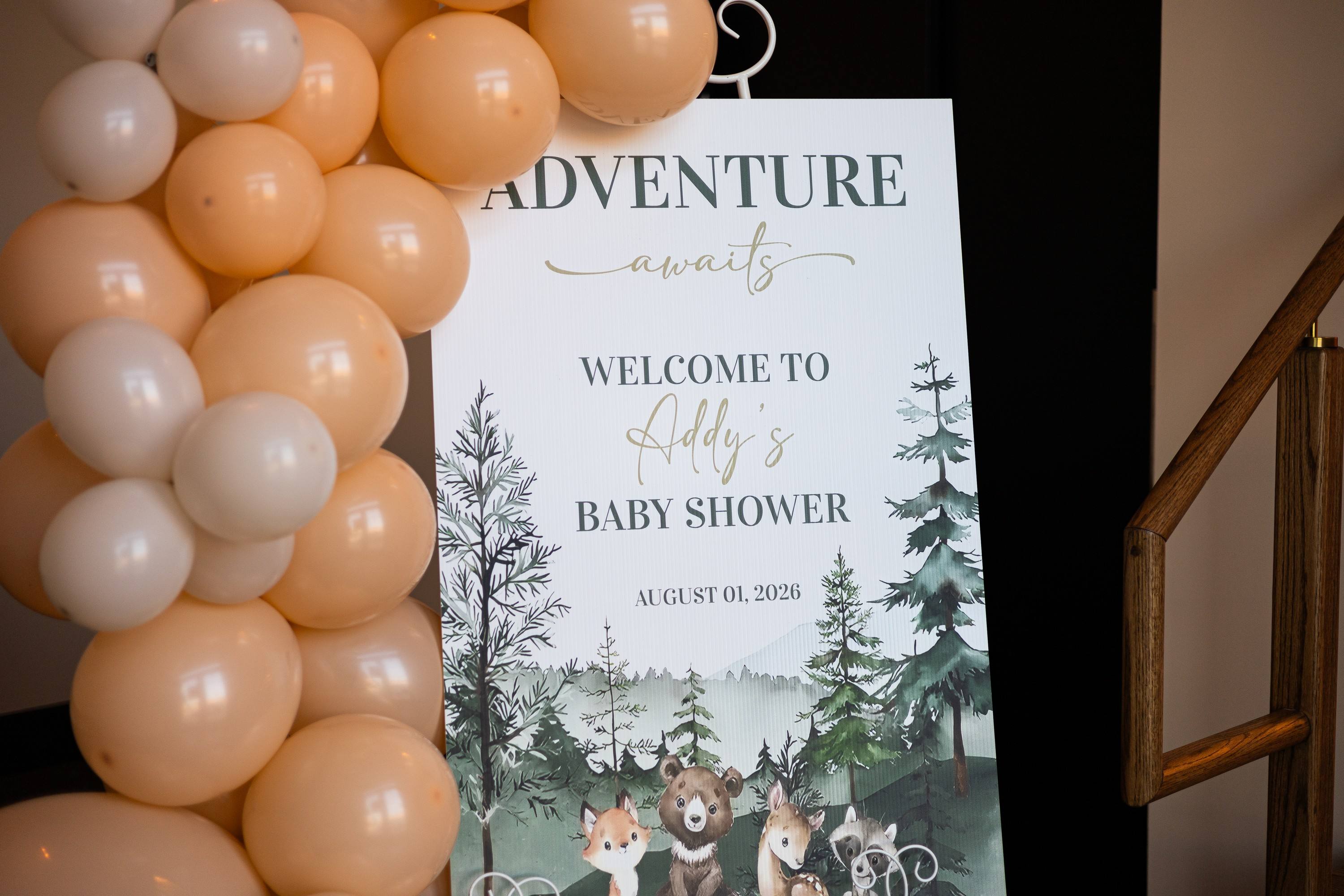 Woodland baby shower welcome sign and balloon garland at The Chestnut Hall